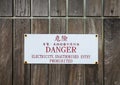 Sign board on wooden wall