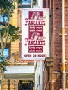 Sign on Brisbane CBD street reading Pancakes Lovely crepes salads steaks with vintage woman saying pe