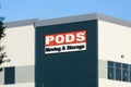 Sign on building corner for PODS Moving and Storage company