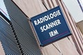 Sign on building indicating radiology MRI and medical scan services (Radiologie Scanner IRM in French)