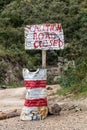 Sign caution road closed in the Hell's Gate National Park, Ken