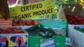 A sign of Certificate of Organic Produce for a trusted seller.