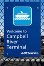 A sign on a chain link fence welcoming people to the BC Ferries Campbell River Terminal
