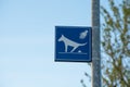 Sign cleaning up dog droppings in city Royalty Free Stock Photo