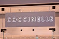 Sign Coccinelle. Company signboard Coccinelle.