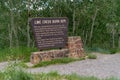 Sign for the Colorado Lime Creek Burn 1879 site marking the area of a man made forest fire