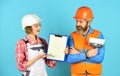 Sign contract with workers. Price list. Couple look documents. Couple planning changes renovation apartment. Renovation Royalty Free Stock Photo