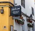 Sign advertises a taverna and wine shop in Cordoba, Spain