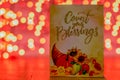 A Sign With a Cornucopia That Says Count Your Blessings With Orange Bokeh Behind It Royalty Free Stock Photo