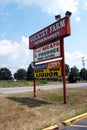 Sign for country Farm Supermarket