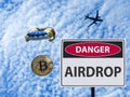 Sign danger airdrop and parachute from the plane token. Royalty Free Stock Photo