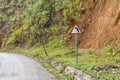 Sign dangerous turn on the mountain road Royalty Free Stock Photo