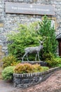 Sign and a deer sculpture at the entrance to the Glenfiddich distillery in Dufftown, Scotland Royalty Free Stock Photo