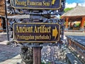 A sign directing tourists to an ancient artefact on the Bai island in Indonesia