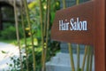 Sign of direction to hair salon in a hotel, resort and spa Royalty Free Stock Photo