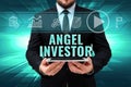Sign displaying Angel Investor. Business showcase high net worth individual who provides financial backing Man In Office