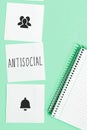 Sign displaying Antisocial. Word for hostile or harmful to organized society being marked deviating