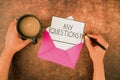 Sign displaying Any Questions Question. Word for Allowing any interrogative statement from a group of Hands Of Woman Royalty Free Stock Photo