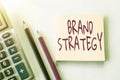 Sign displaying Brand Strategy. Internet Concept Longterm plan for the development of a successful brand Plain Spiral