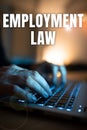 Hand writing sign Employment Law. Word for deals with legal rights and duties of employers and employees