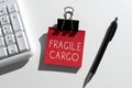 Sign displaying Fragile Cargo. Concept meaning Breakable Handle with Care Bubble Wrap Glass Hazardous Goods Important Messages