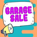 Sign displaying Garage Sale. Concept meaning sale of miscellaneous household goods often held in the garage