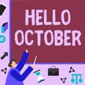 Sign displaying Hello October. Business concept Last Quarter Tenth Month 30days Season Greeting Businessman Pointing