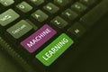 Text showing inspiration Machine Learning. Concept meaning the concept that a computer can learn new data itself Royalty Free Stock Photo