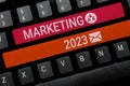 Sign displaying Marketing 2023. Business idea Commercial trends for 2023 New Year promotional event