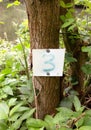 A sign displaying number three