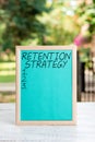 Sign displaying Retention Strategy. Business idea activities to reduce employee turnover and attrition