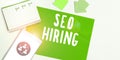 Sign displaying Seo Hiring. Word Written on employing a specialist will develop content to include keywords