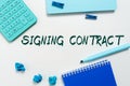 Sign displaying Signing Contract. Business concept keeping the website secure updated running and bugfree Royalty Free Stock Photo