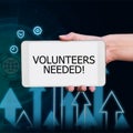 Sign displaying Volunteers Needed. Internet Concept Social Community Charity Volunteerism