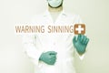 Sign displaying Warning Sinning. Concept meaning stop the action which is believed to break the laws Doctor Explaining