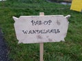 Sign with dutch text `Pas op wandelaars ` which means beware for hikers during hiking tour in Royalty Free Stock Photo