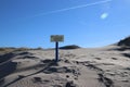 Sign with dutch text Verboden toegang which means in English no admittance of the water authority Delfland in the dunes of Monster