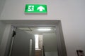 Sign : Emergency exit sign at path way indoor building public facility that emergency escape route is left. fire, building, Royalty Free Stock Photo