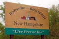 A sign, in English and French, welcomes visitors to New Hampshire