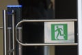 Sign - exit, green emergency exit on turnstile