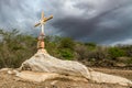 A sign of faith, a cross, beautiful clouds in a dry land at Cariri Paraiba Brazil Countryside