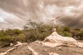 A sign of faith, a cross, beautiful clouds in a dry land at Cariri Paraiba Brazil Countryside