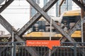 Sign featuring an orange box with a text 'What's That Noise?' with trains passing on the background