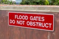 A sign on a flood gate that reads flood gates do not obstruct Royalty Free Stock Photo