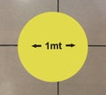 Sign on the floor: keep 1 meter distance. Social distancing with Coronavirus,