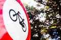 Sign forbidden to ride a bicycle, placed in a forest Royalty Free Stock Photo