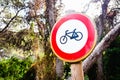 Sign forbidden to ride a bicycle, placed in a forest Royalty Free Stock Photo