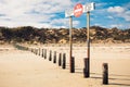 A sign forbidding entry to the beach by unauthorized cars