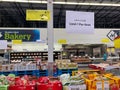 A sign in the fresh produce aisle of a Sams Club stating that customers may only buy 1 per item