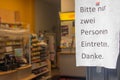 Sign in front of a store in Frankfurt Bockenheim, with a message regarding the Coronavirus COVID-19